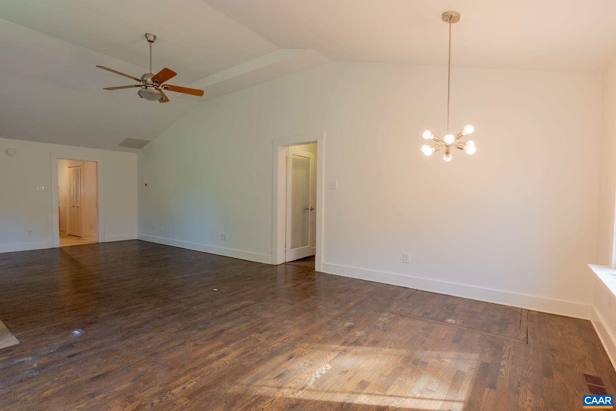 2514 Taylors Gap Road North Garden, VA 22959 - Photo 26 of 75 a view of a room with wooden floor and ceiling fan