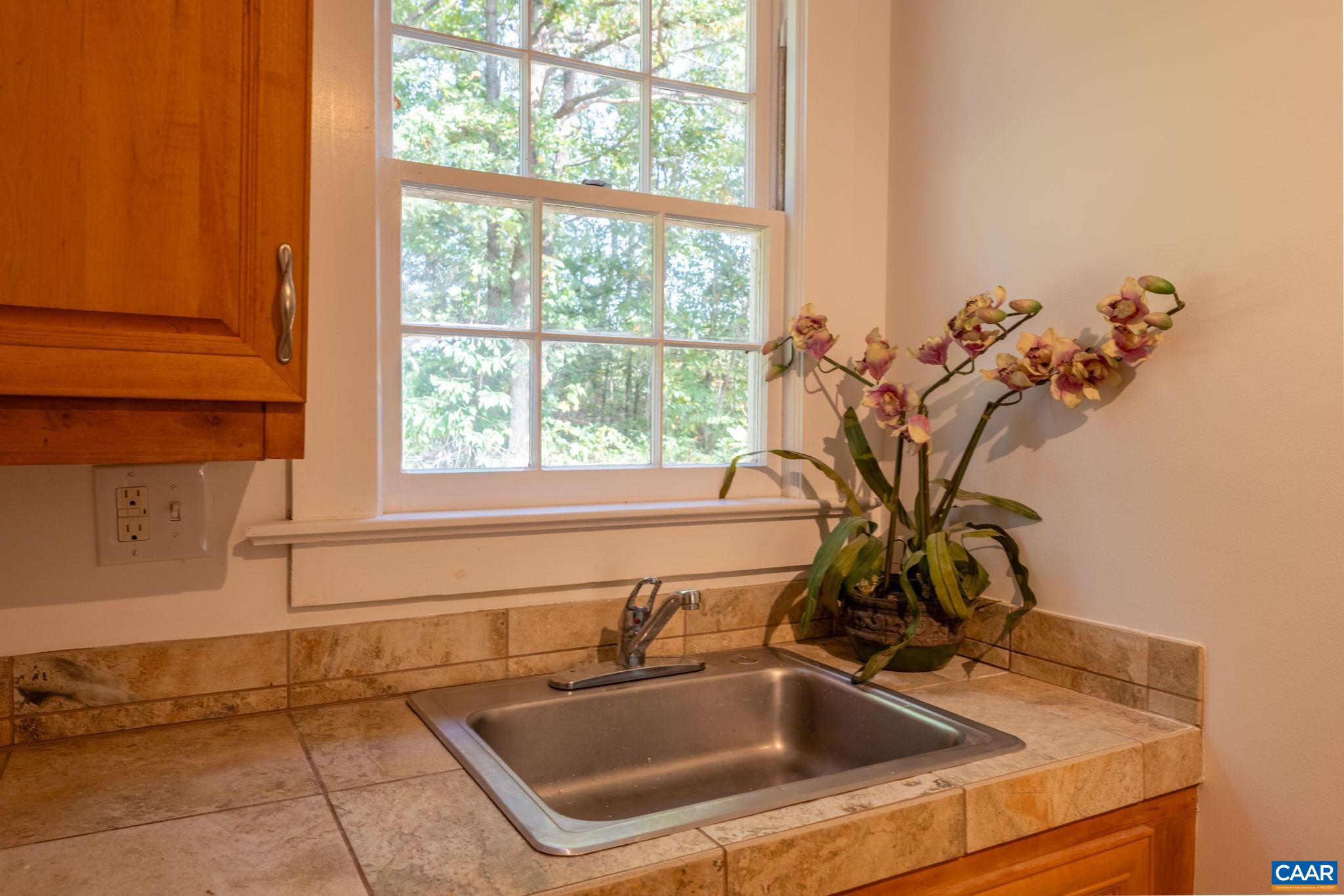 2514 Taylors Gap Road North Garden, VA 22959 - Photo 30 of 75 a bathroom with a sink and a window