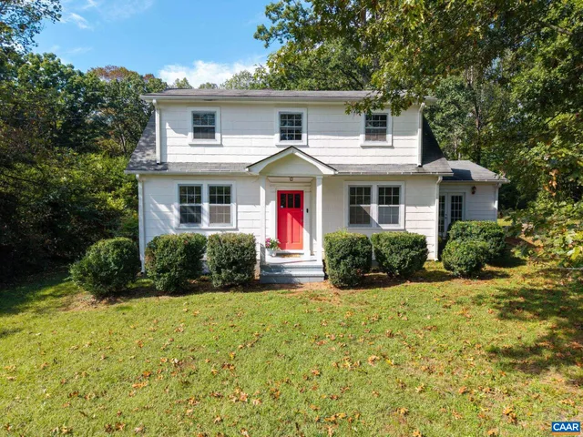 a view of a house with a yard and plants