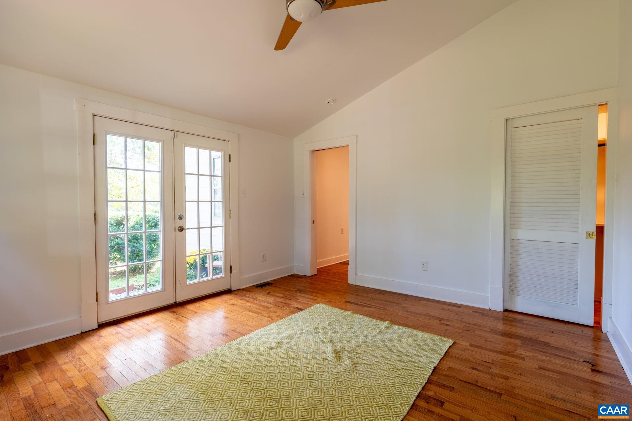 2514 Taylors Gap Road North Garden, VA 22959 - Photo 36 of 75 an empty room with wooden floor and windows