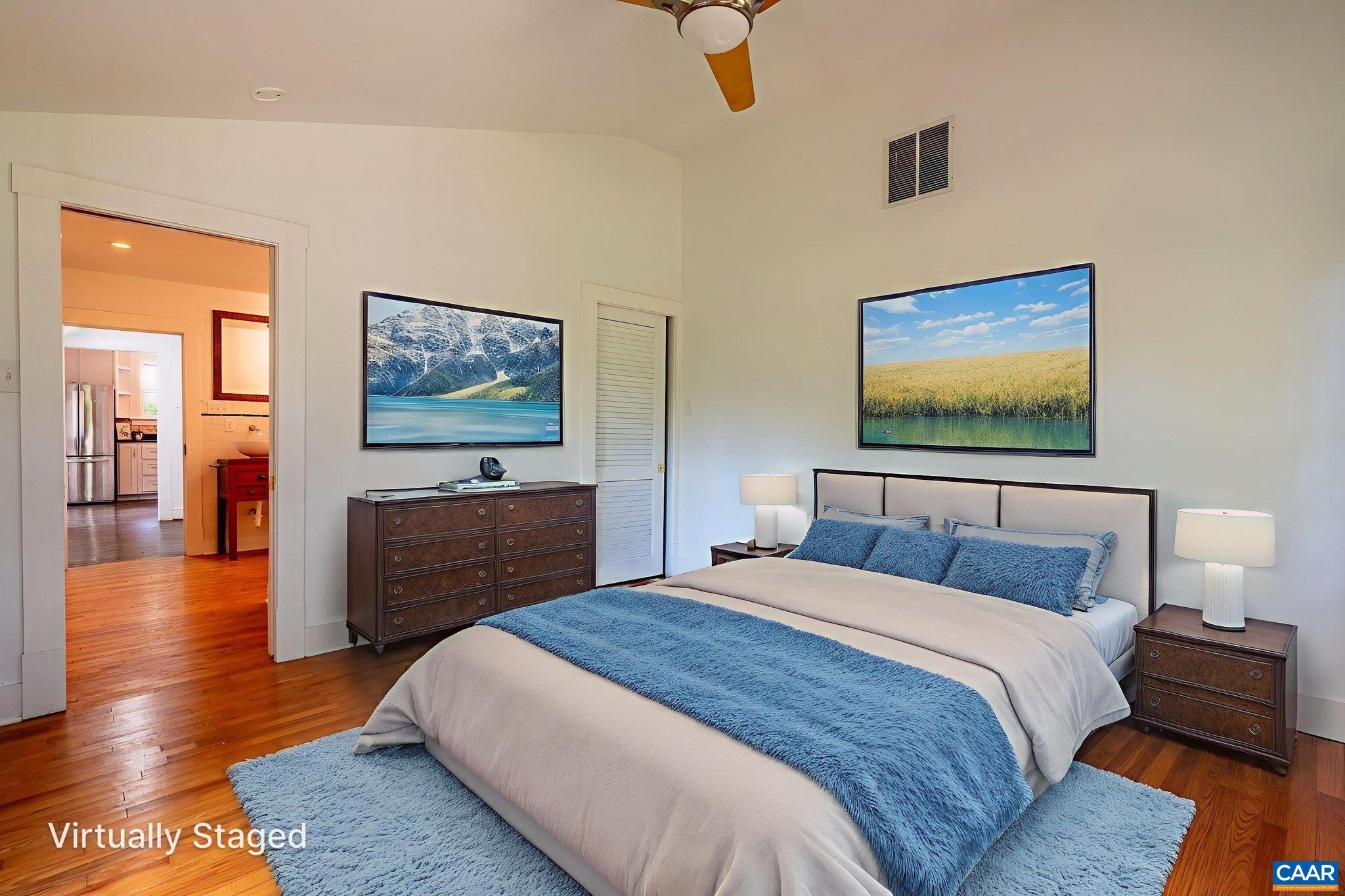 2514 Taylors Gap Road North Garden, VA 22959 - Photo 39 of 75 a bedroom with a bed and a flat screen tv