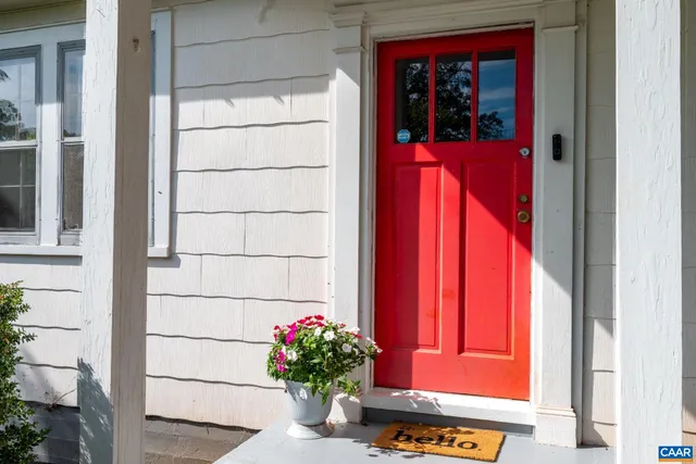 an empty room with wooden floor and a window