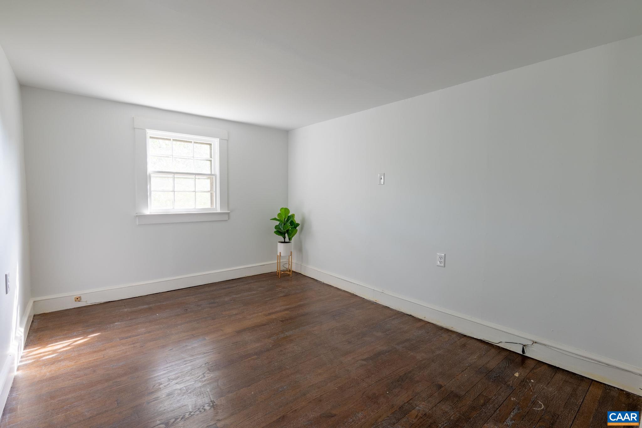 2514 Taylors Gap Road North Garden, VA 22959 - Photo 52 of 75 an empty room with wooden floor and windows