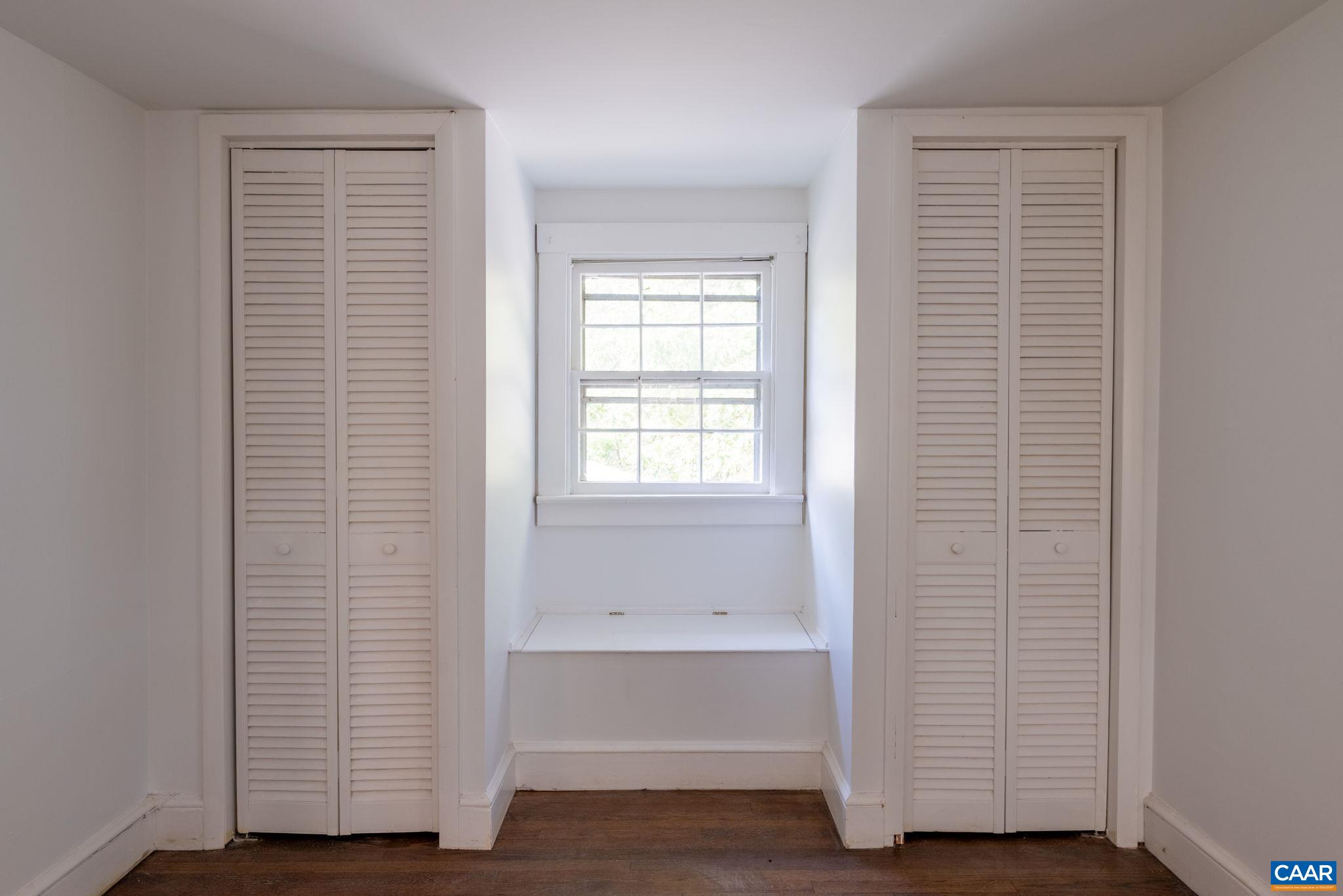 2514 Taylors Gap Road North Garden, VA 22959 - Photo 54 of 75 a view of an empty room with wooden floor and a window