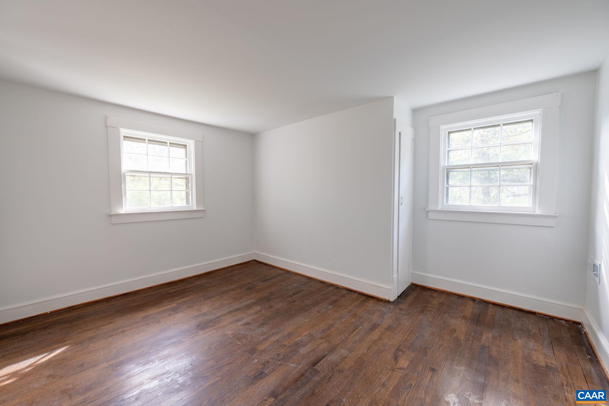 2514 Taylors Gap Road North Garden, VA 22959 - Photo 57 of 75 a view of a room that has wooden floor and windows in it