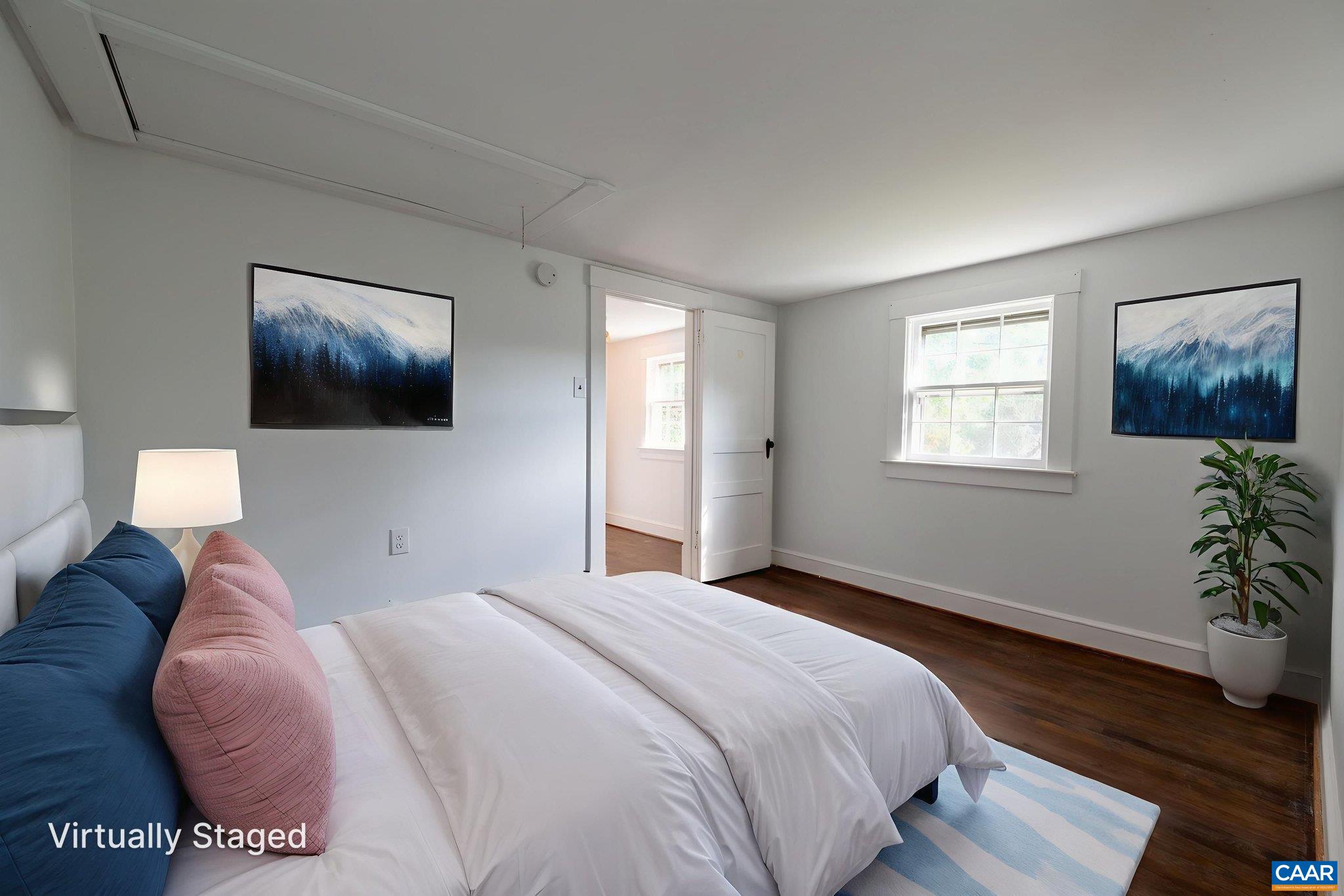 2514 Taylors Gap Road North Garden, VA 22959 - Photo 59 of 75 a bedroom with a bed and a potted plant