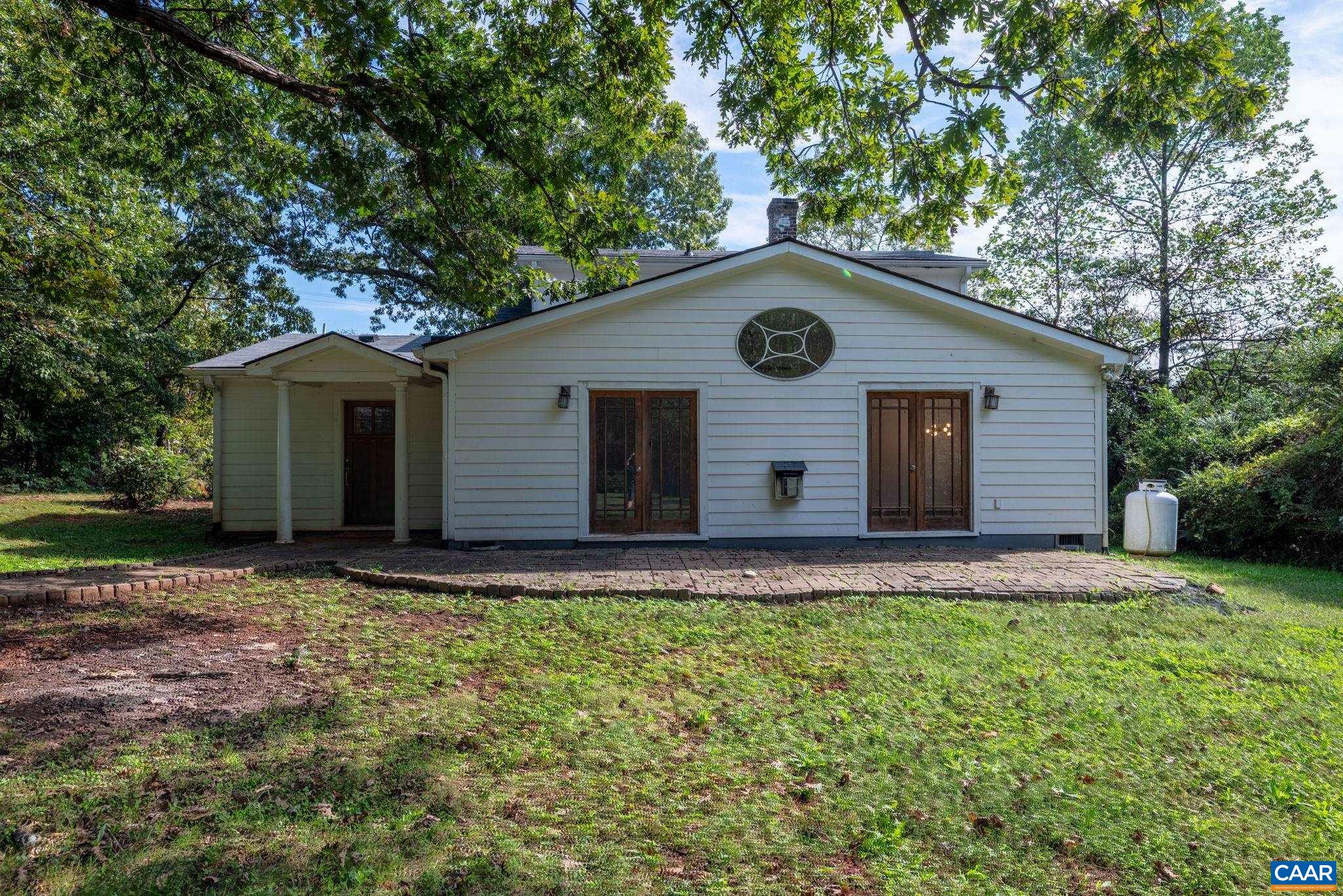 2514 Taylors Gap Road North Garden, VA 22959 - Photo 64 of 75 a front view of a house with a garden and yard