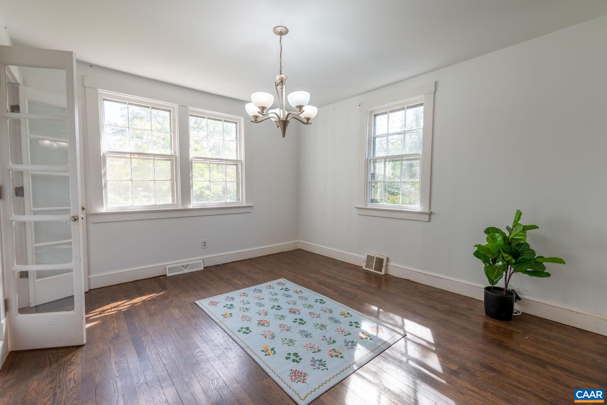 2514 Taylors Gap Road North Garden, VA 22959 - Photo 9 of 75 a view of an empty room with a window and wooden floor