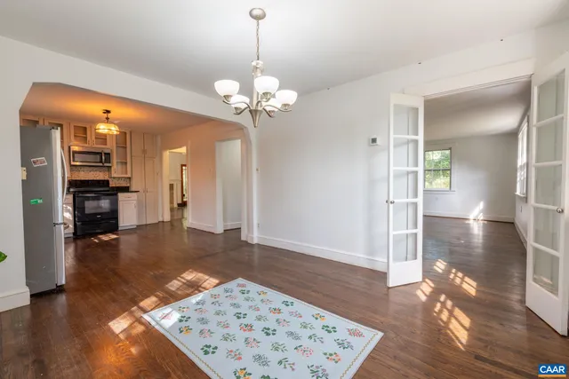 a kitchen with granite countertop a stove and a refrigerator