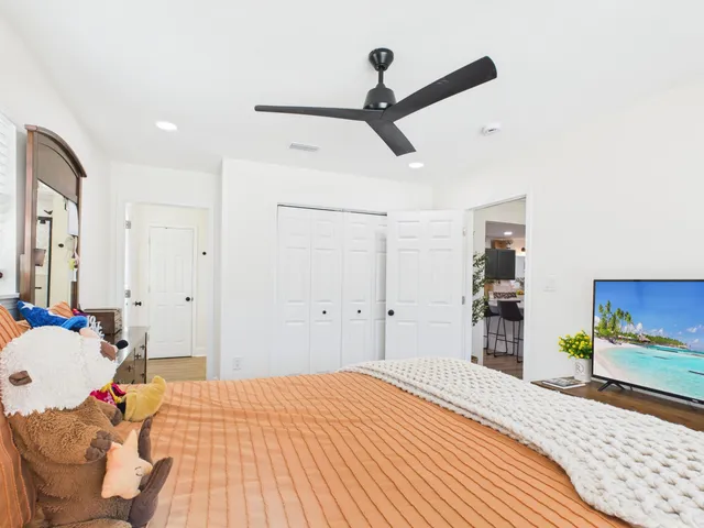 a living room with furniture and a book shelf
