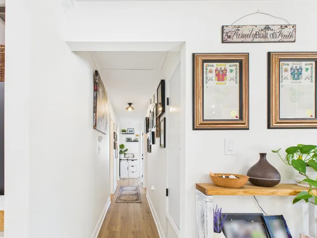 a living room with furniture a rug and a chandelier
