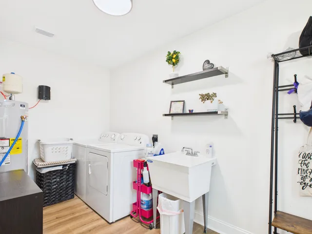 a view of a livingroom with a fireplace and workspace
