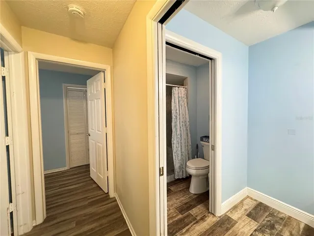 a view of a bathroom from a hallway