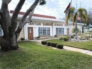 a view of a house with a yard and plants
