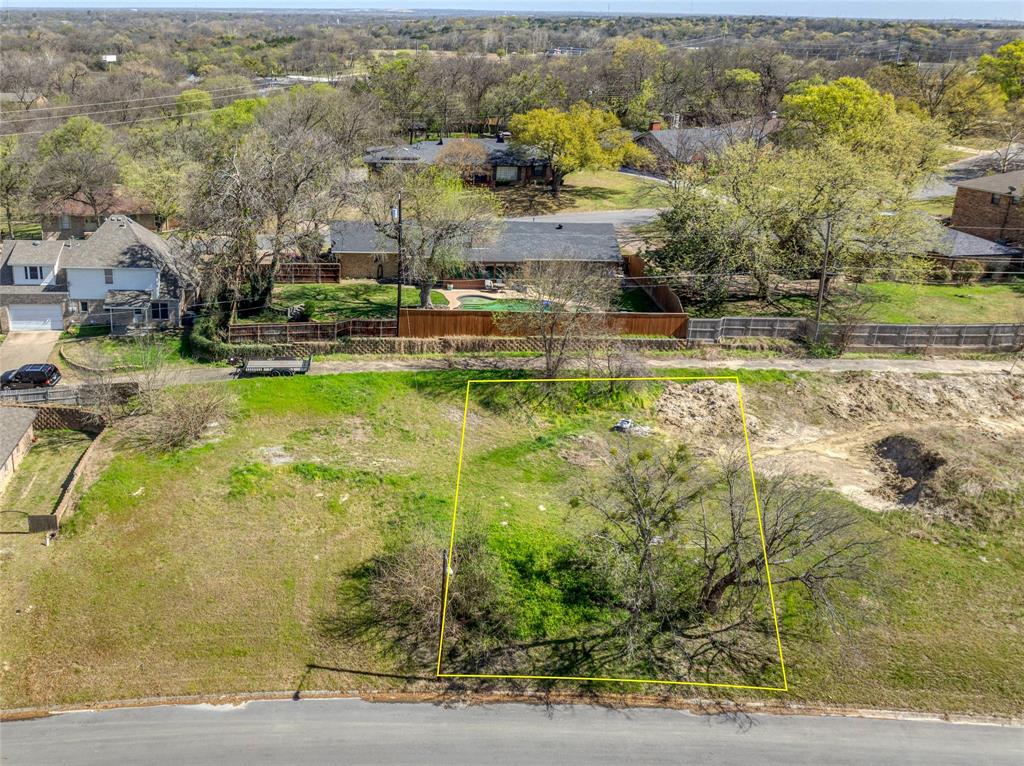 311 Arapaho W Road Sherman, TX 75092 - Photo 2 of 8 a view of a lake with a houses