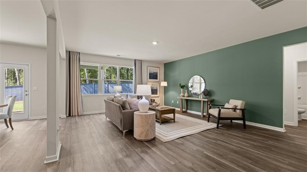 351 Bullock Pass Jefferson, GA 30549 - Photo 26 of 83 a living room with furniture and a wooden floor