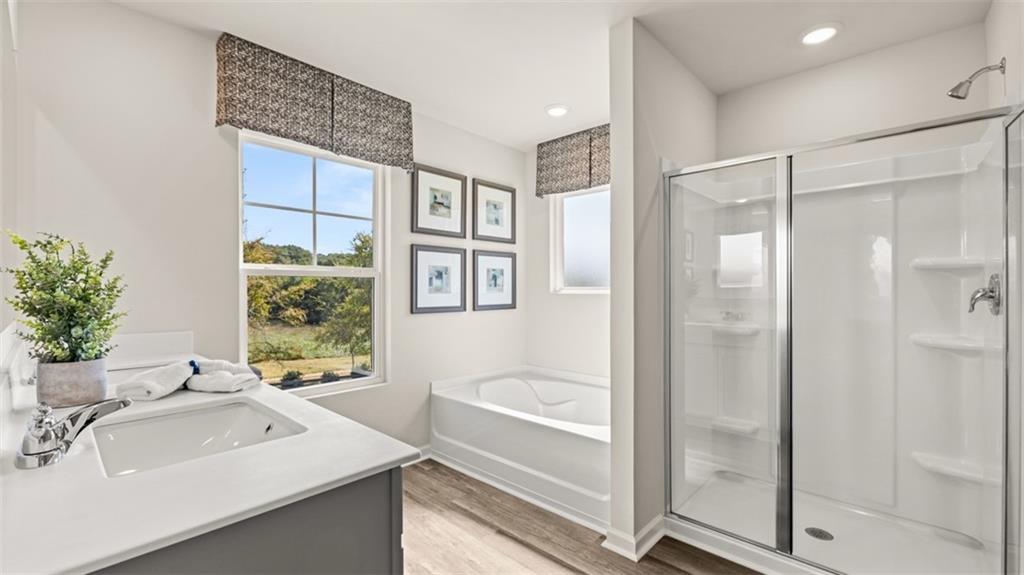 351 Bullock Pass Jefferson, GA 30549 - Photo 48 of 83 a bathroom with a sink a mirror and a shower