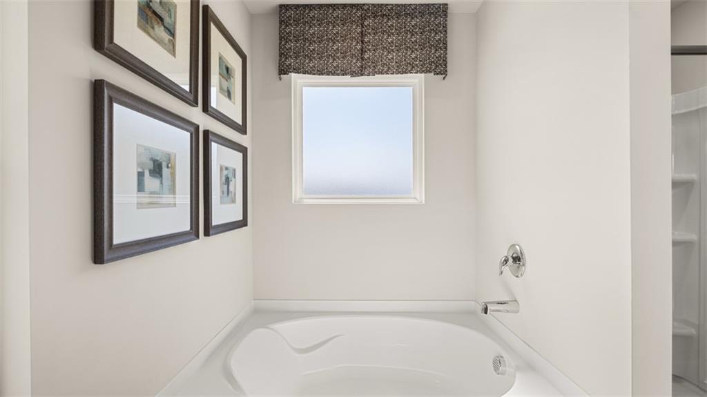 351 Bullock Pass Jefferson, GA 30549 - Photo 49 of 83 a bathroom with a bathtub and a shower