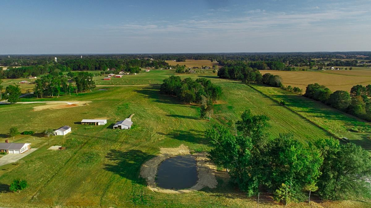 1 Sterling Road Ardmore, AL 35739 - Photo 2 of 4 a view of a garden with a lake