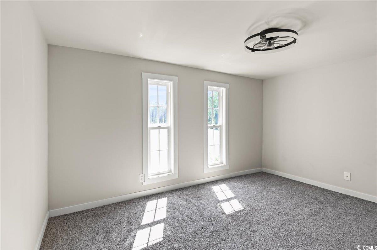 446 Sonny Road Gresham, SC 29546 - Photo 14 of 40 Spare room featuring baseboards and carpet