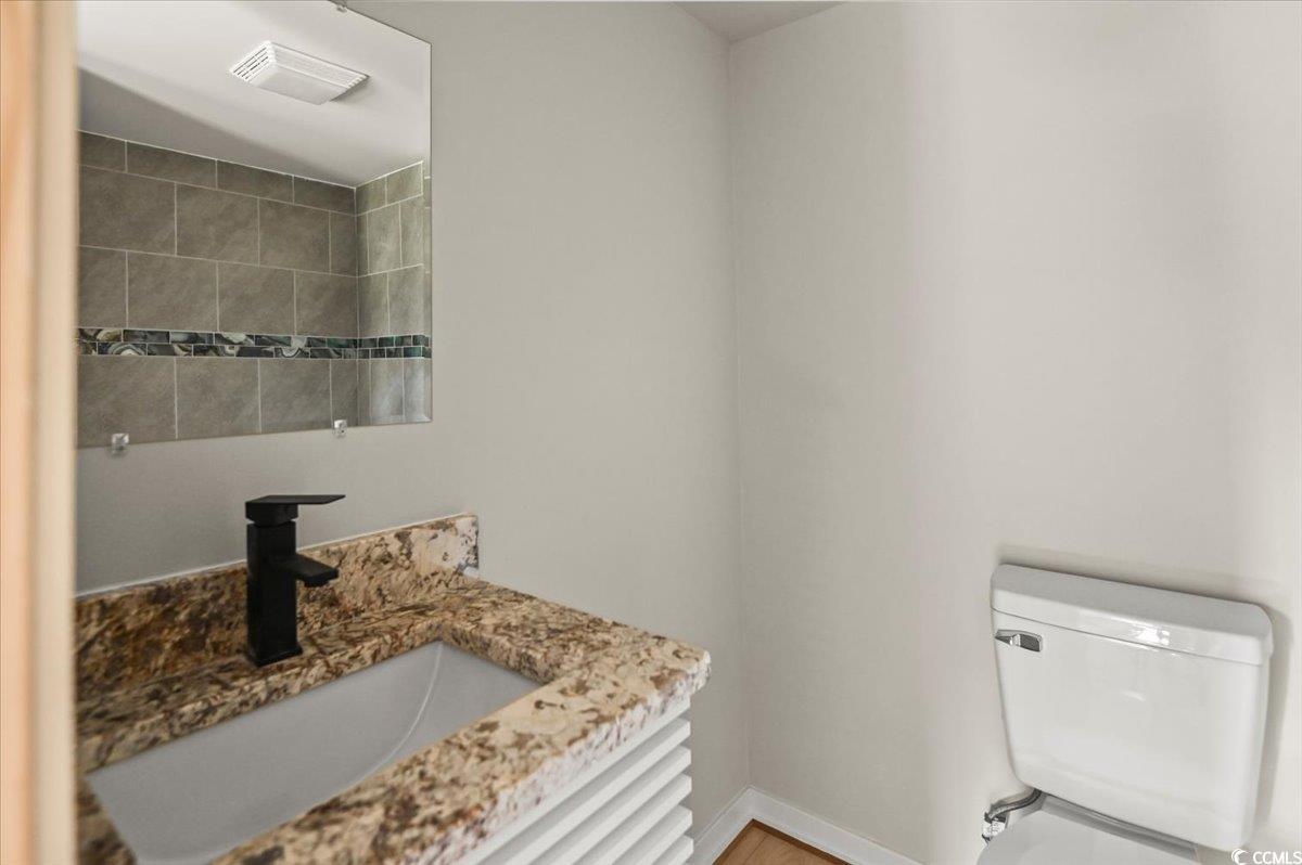 446 Sonny Road Gresham, SC 29546 - Photo 17 of 40 Bathroom with toilet, vanity, and baseboards