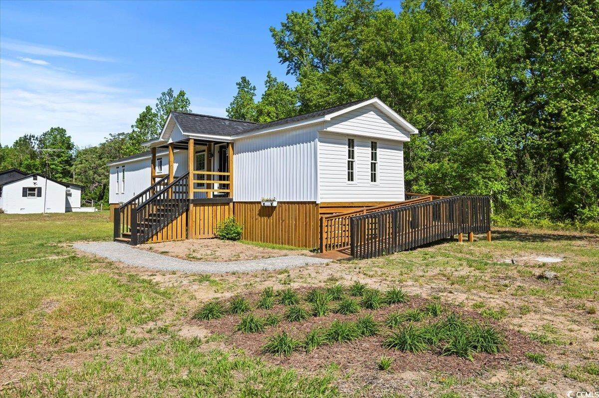446 Sonny Road Gresham, SC 29546 - Photo 3 of 40 Manufactured / mobile home with a front lawn and stairway