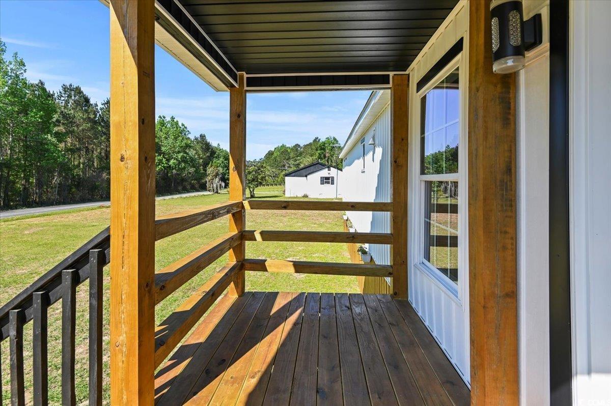446 Sonny Road Gresham, SC 29546 - Photo 4 of 40 Wooden terrace with a lawn
