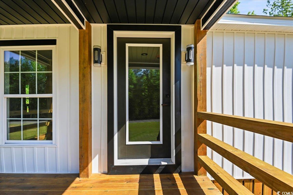 446 Sonny Road Gresham, SC 29546 - Photo 5 of 40 Doorway to property with board and batten siding