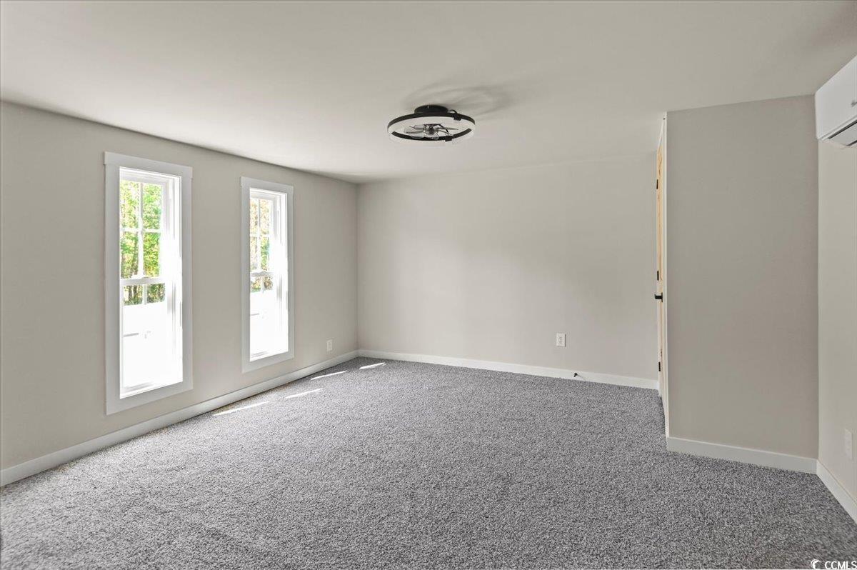 446 Sonny Road Gresham, SC 29546 - Photo 10 of 40 Unfurnished room featuring baseboards and carpet