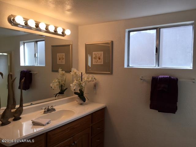 4165 North Pima Way Rimrock, AZ 86335 - Photo 13 of 22 a bathroom with a sink vanity and a mirror