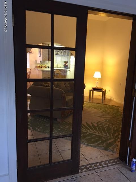 4165 North Pima Way Rimrock, AZ 86335 - Photo 7 of 22 a room with wooden floor and a glass door