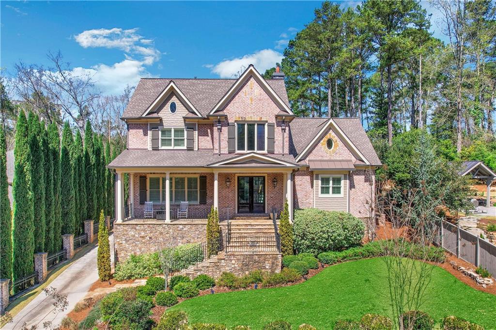 1070 Canter Road Northeast Atlanta, GA 30324 - Photo 1 of 1 a front view of a house with a garden