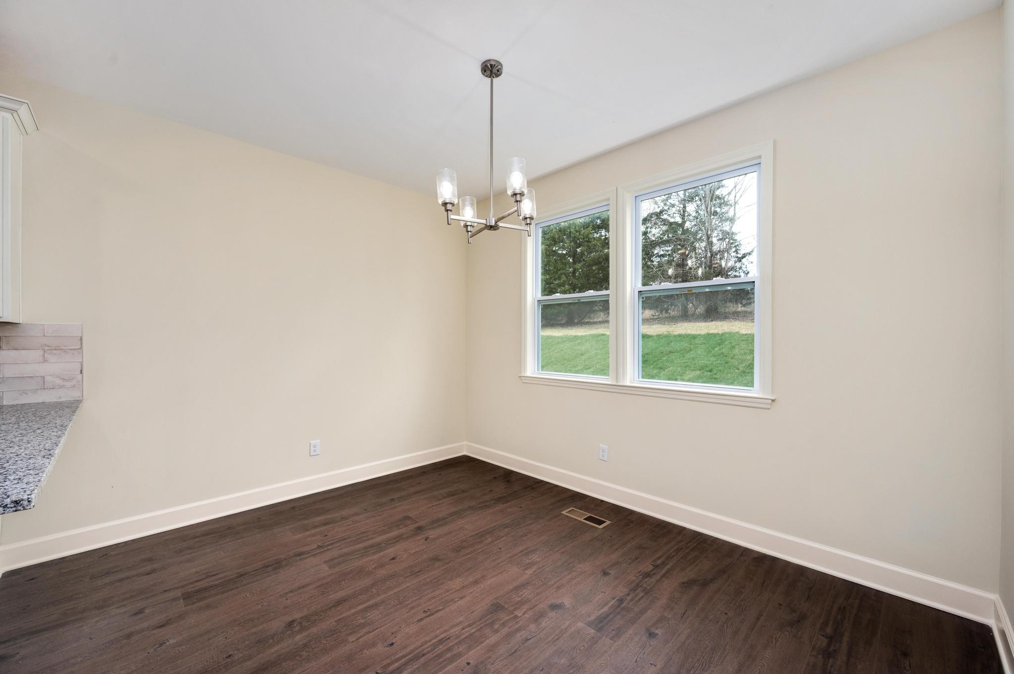 157 Lena Loop Burns, TN 37029 - Photo 11 of 49 a view of a room with wooden floor fan and a window
