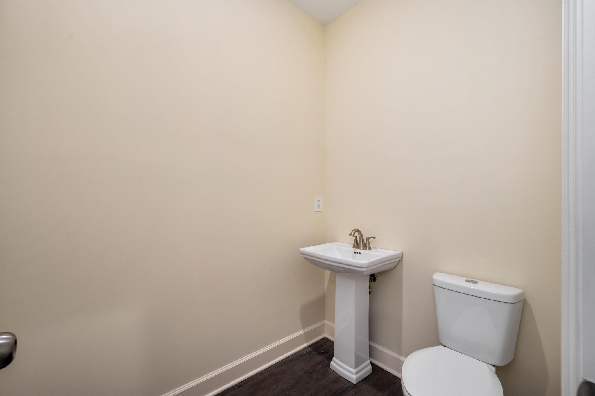 157 Lena Loop Burns, TN 37029 - Photo 14 of 49 a bathroom with a sink and a toilet