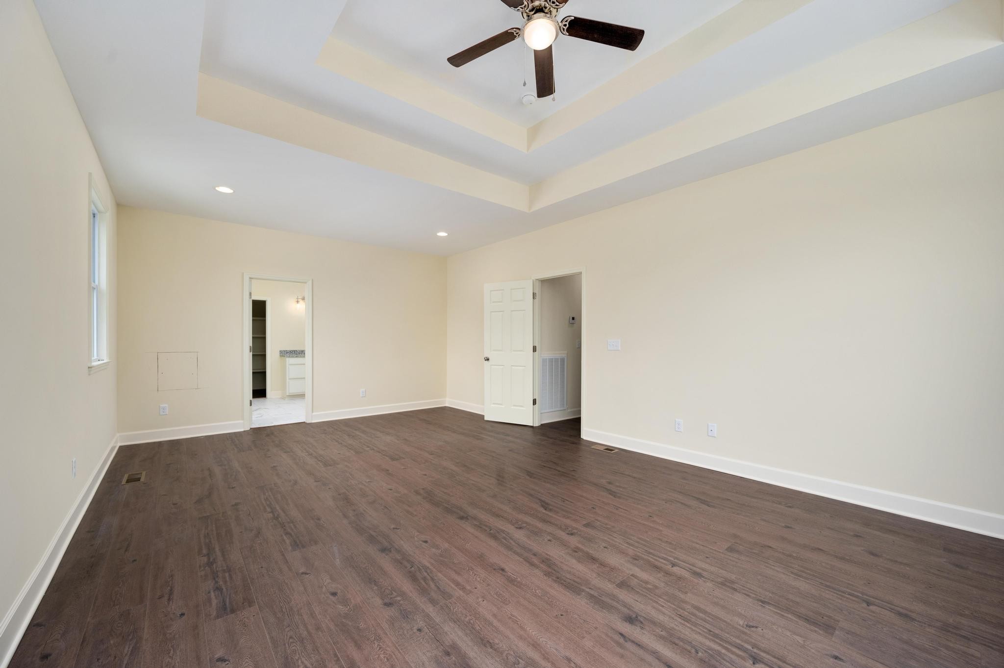157 Lena Loop Burns, TN 37029 - Photo 17 of 49 wooden floor in an empty room with a window