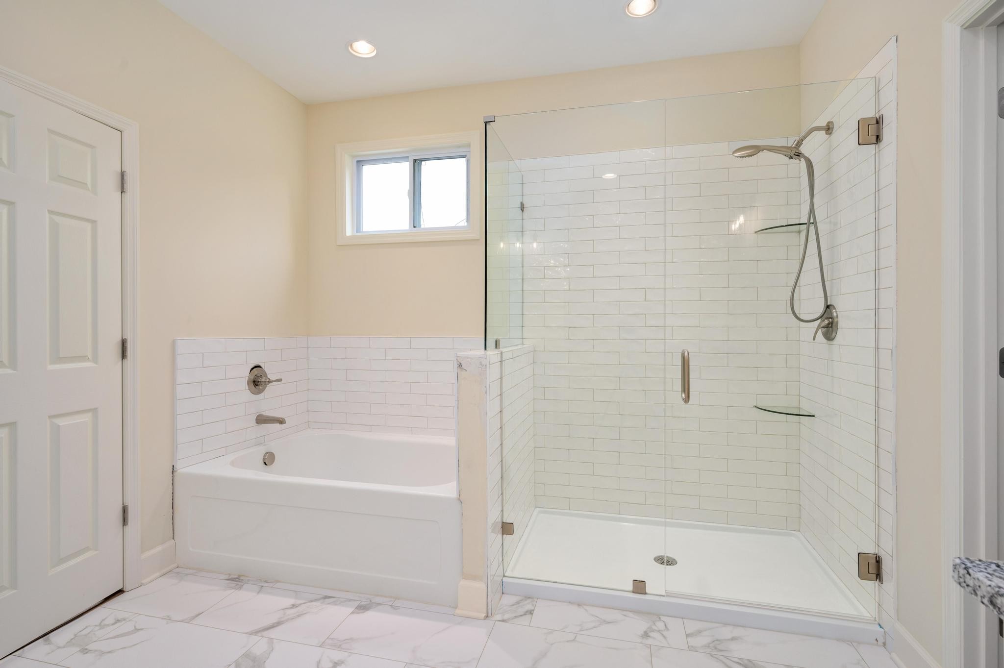 157 Lena Loop Burns, TN 37029 - Photo 19 of 49 a white bath tub sitting next to a shower