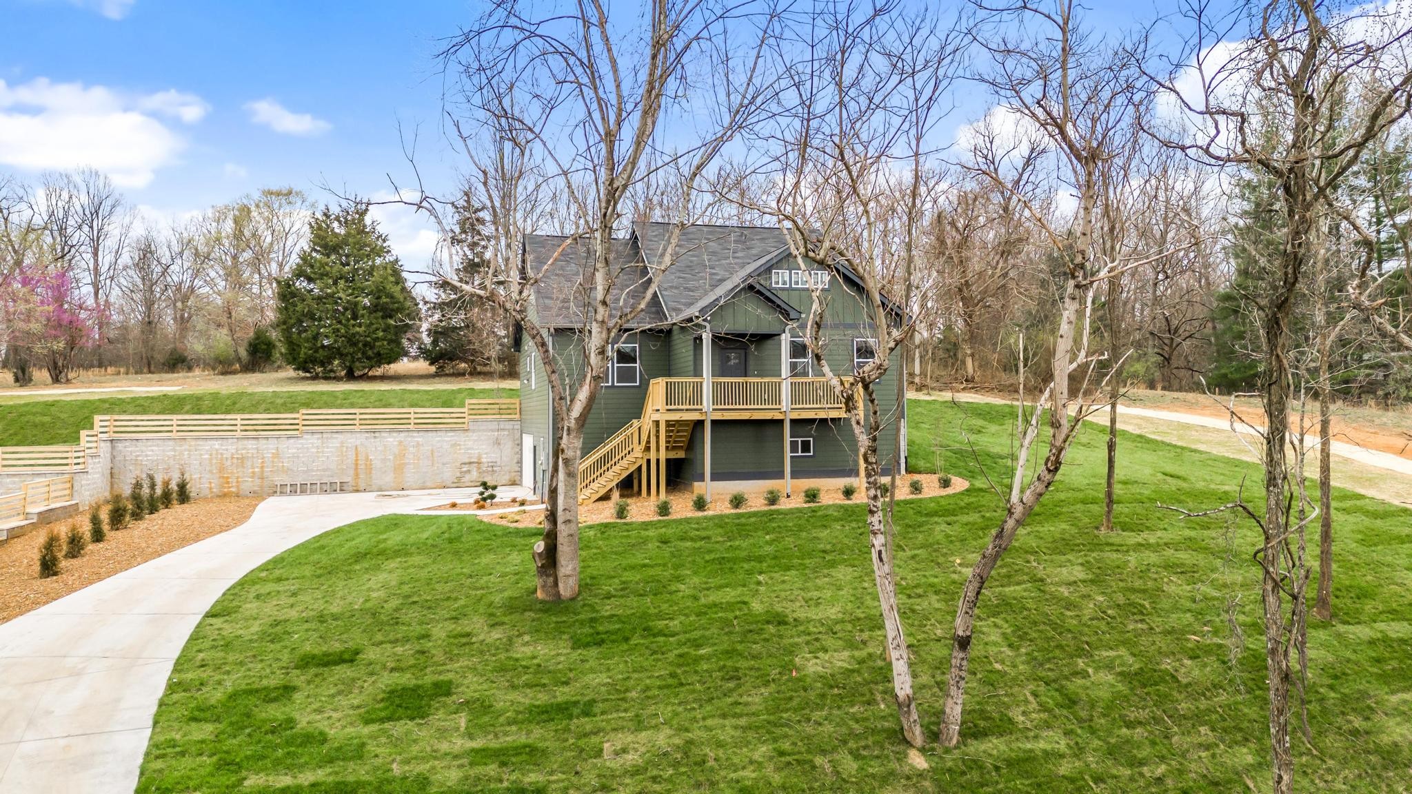157 Lena Loop Burns, TN 37029 - Photo 2 of 49 a view of a house with a yard