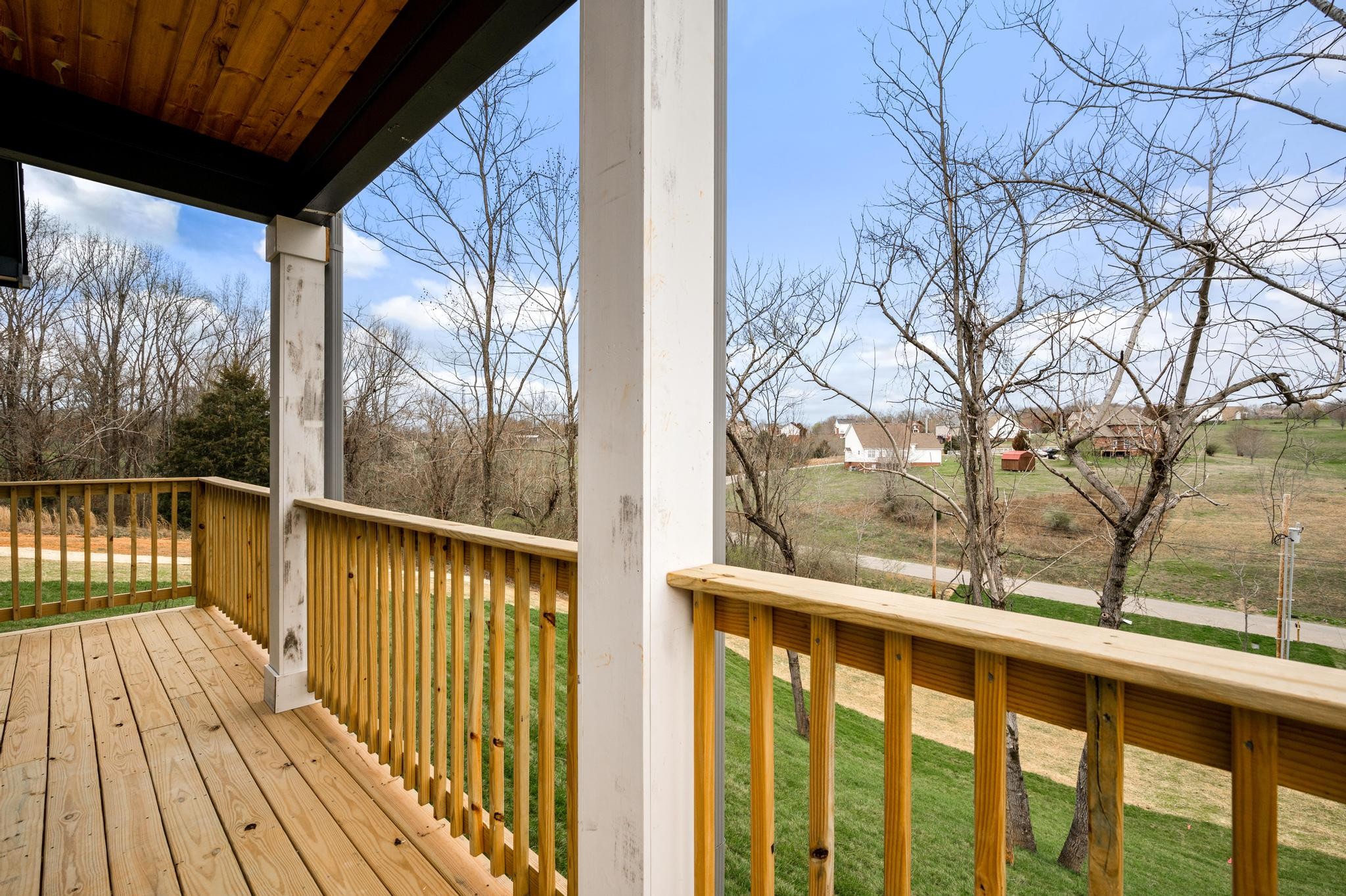 157 Lena Loop Burns, TN 37029 - Photo 27 of 49 a view of a balcony with wooden floor