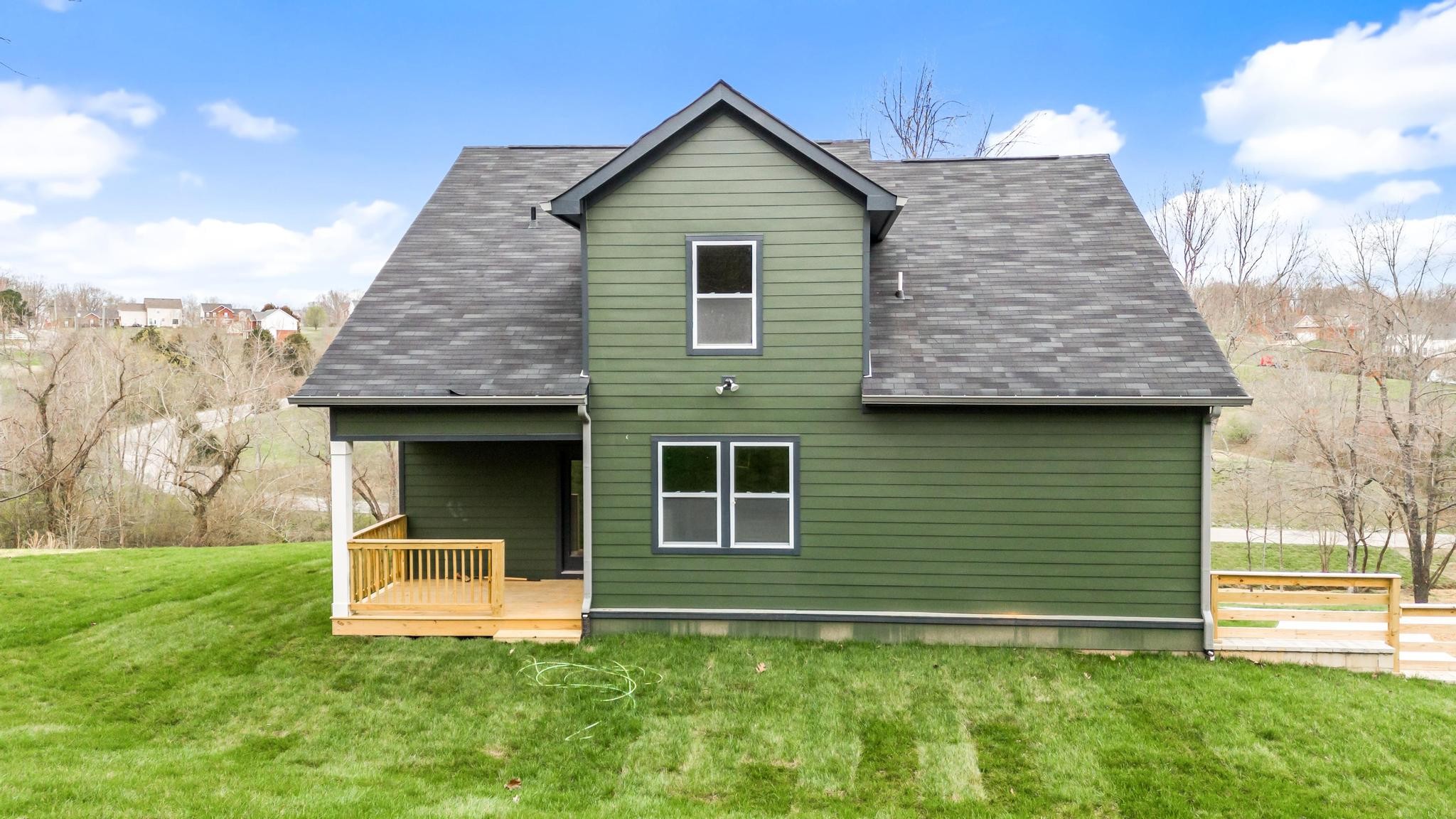 157 Lena Loop Burns, TN 37029 - Photo 33 of 49 a front view of a house with garden