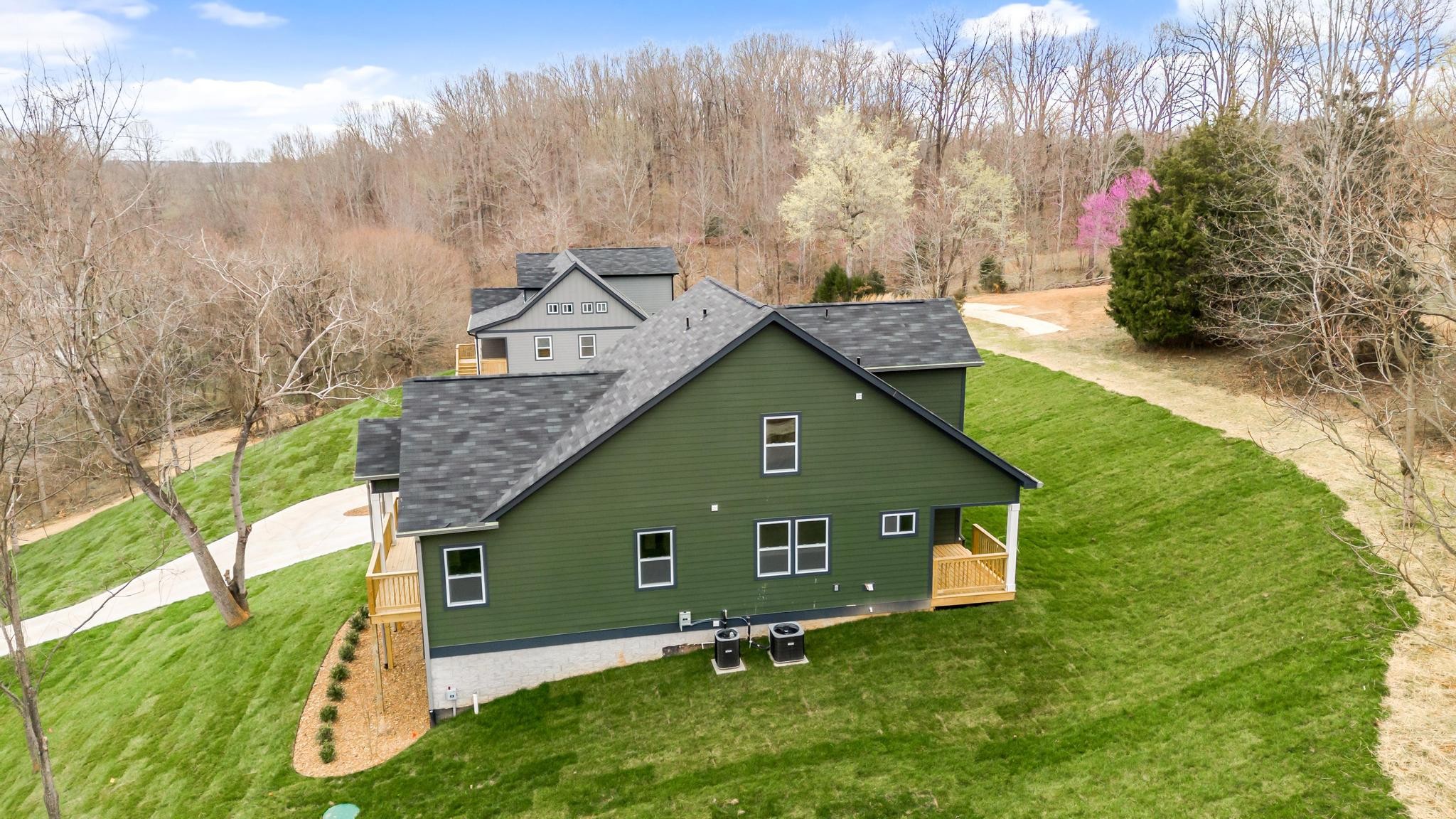 157 Lena Loop Burns, TN 37029 - Photo 36 of 49 a view of a house with a yard