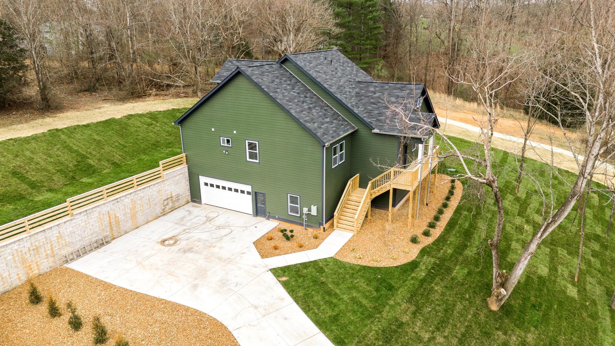 157 Lena Loop Burns, TN 37029 - Photo 41 of 49 a view of a house with a swimming pool