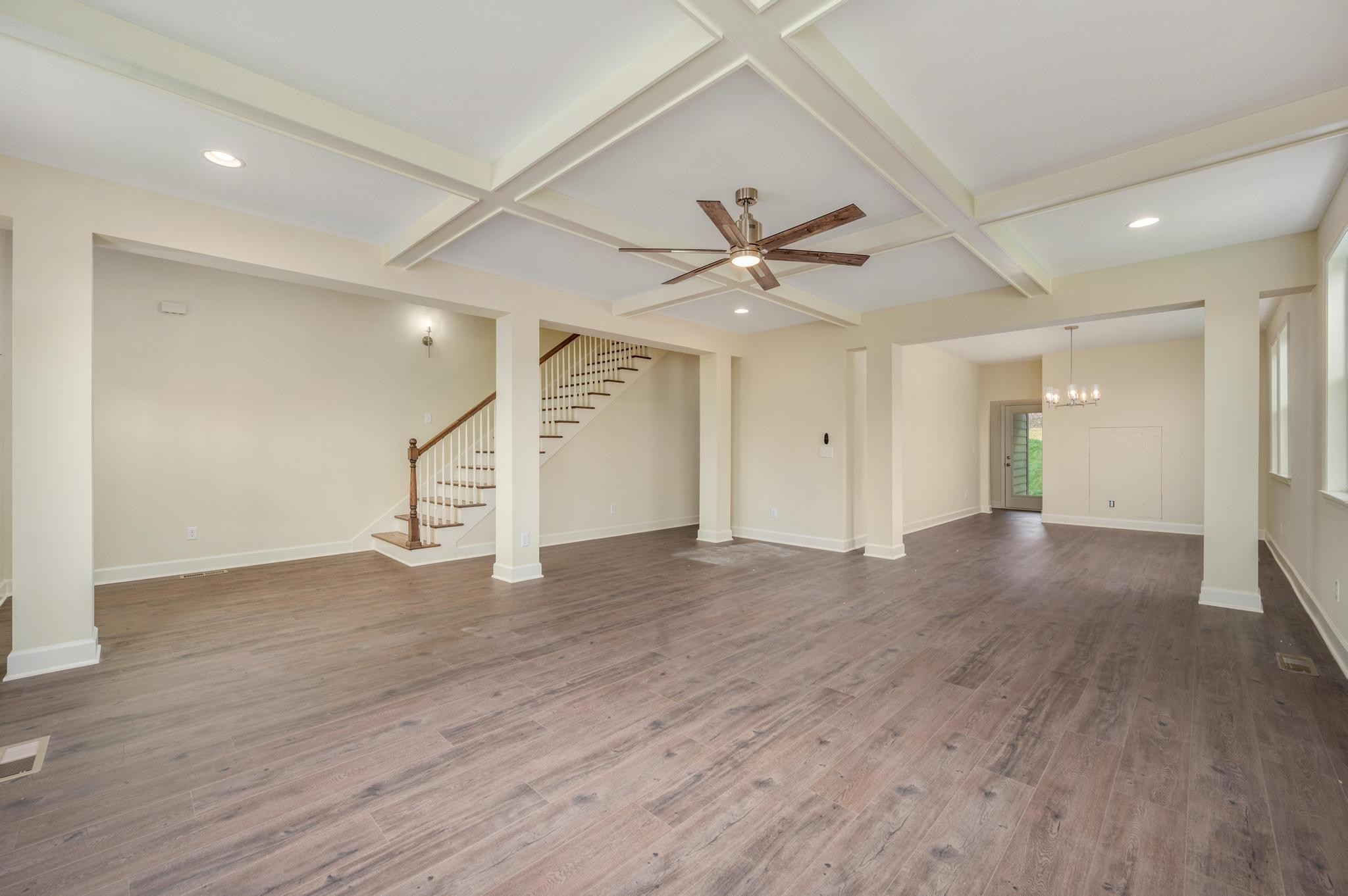 157 Lena Loop Burns, TN 37029 - Photo 5 of 49 an empty room with wooden floor and ceiling fan