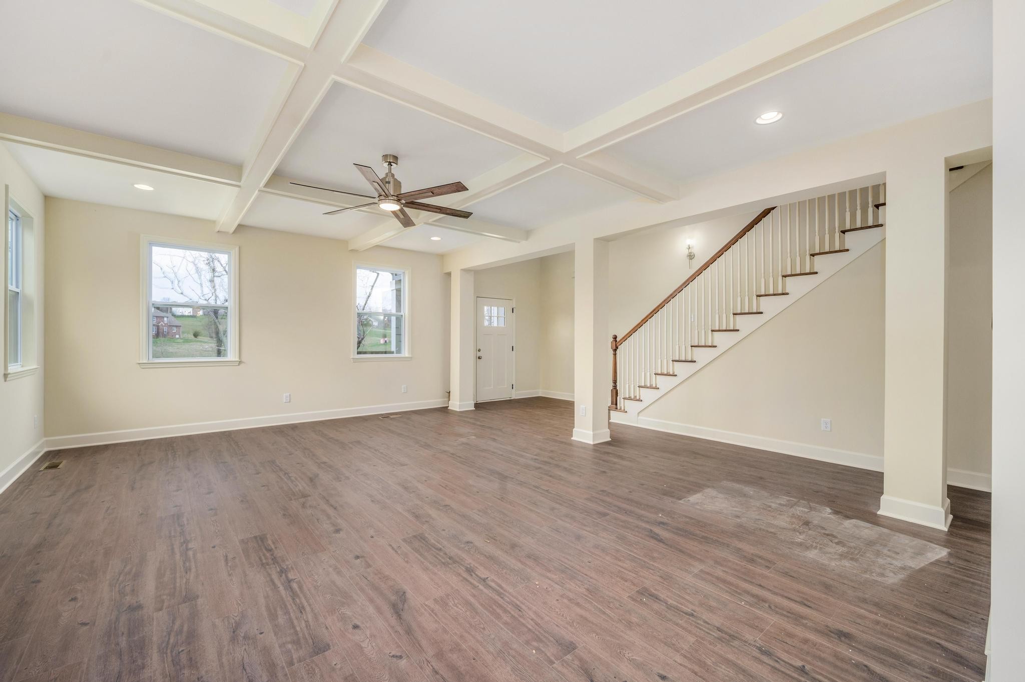 157 Lena Loop Burns, TN 37029 - Photo 6 of 49 a view of an empty room with wooden floor and a window