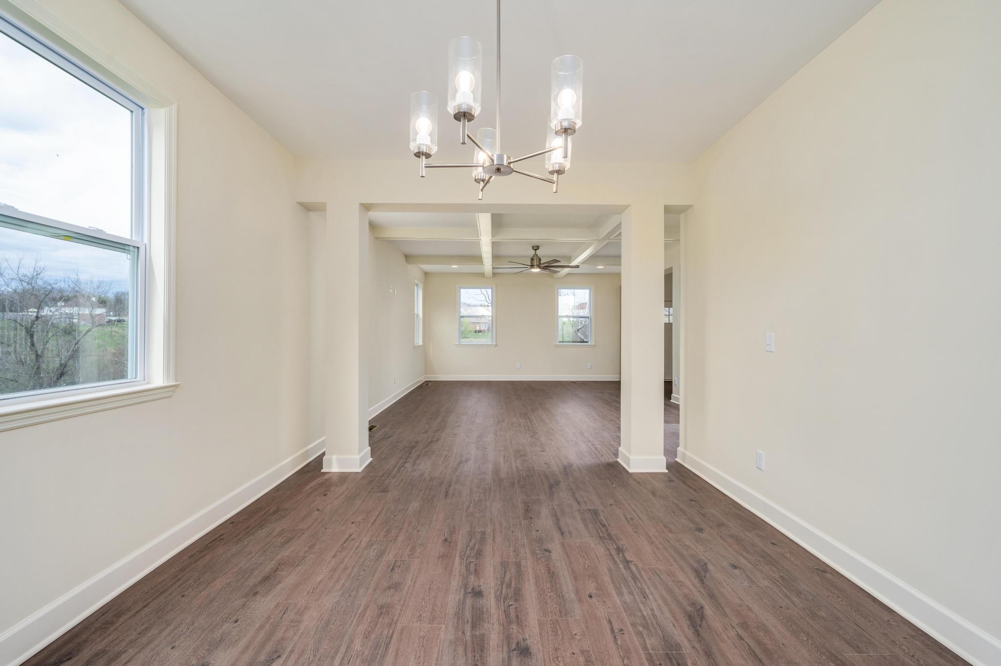 157 Lena Loop Burns, TN 37029 - Photo 8 of 49 wooden floor in an empty room with a window