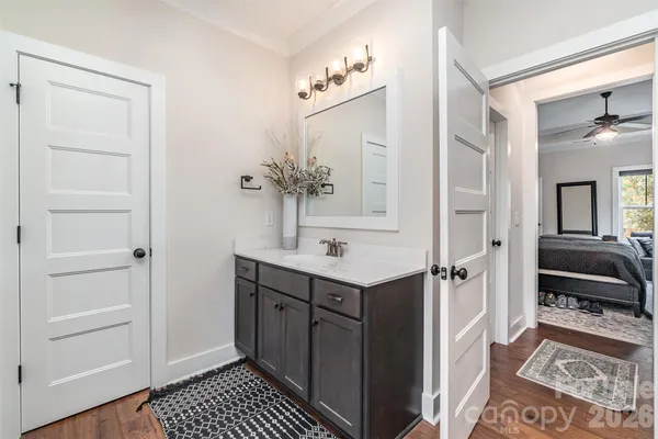 a spacious bathroom with a sink and a mirror