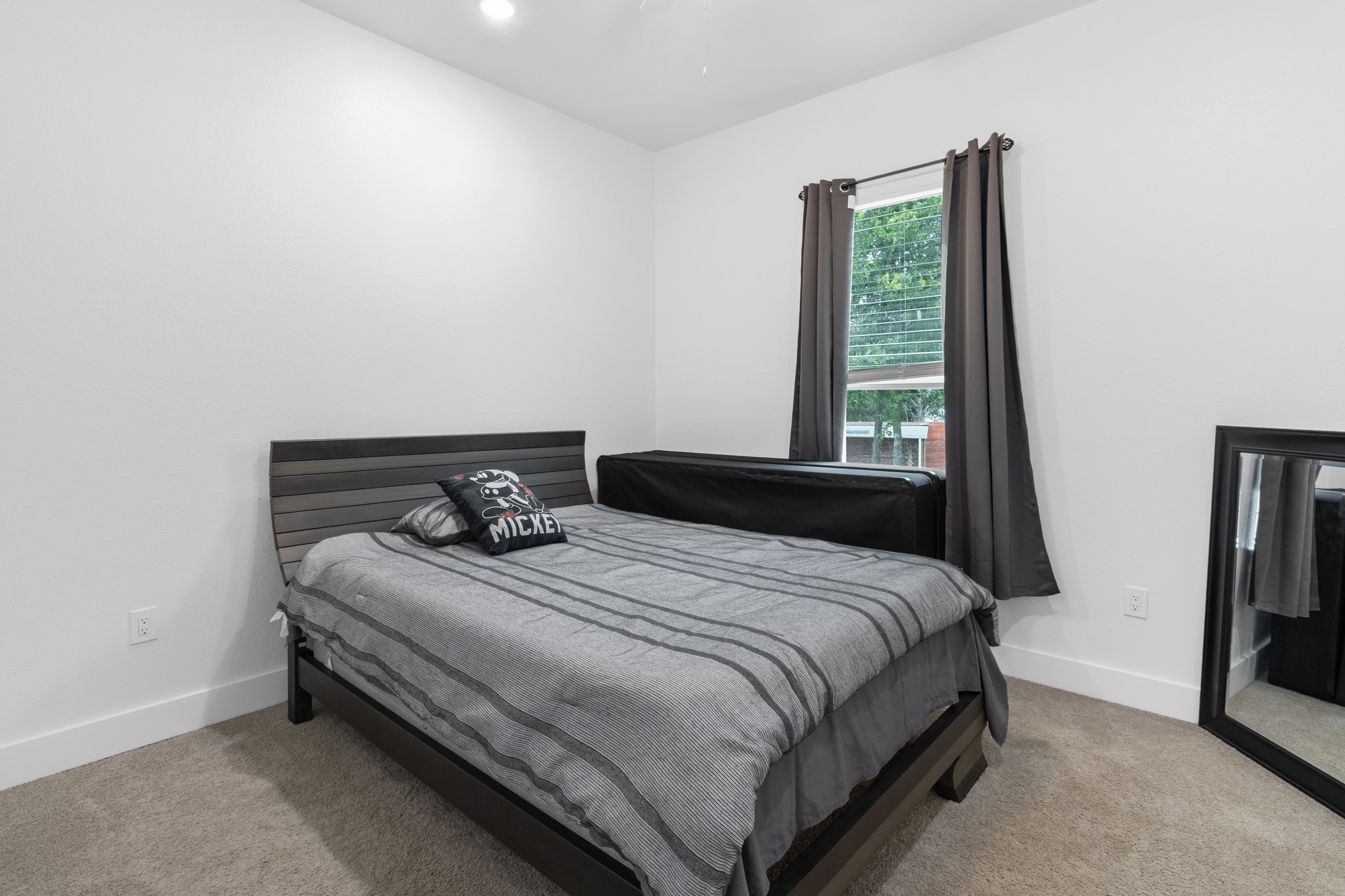 123 Zacate Street Elgin, TX 78621 - Photo 15 of 33 Carpeted room featuring a single window with dark curtains, white walls, and a recessed ceiling light