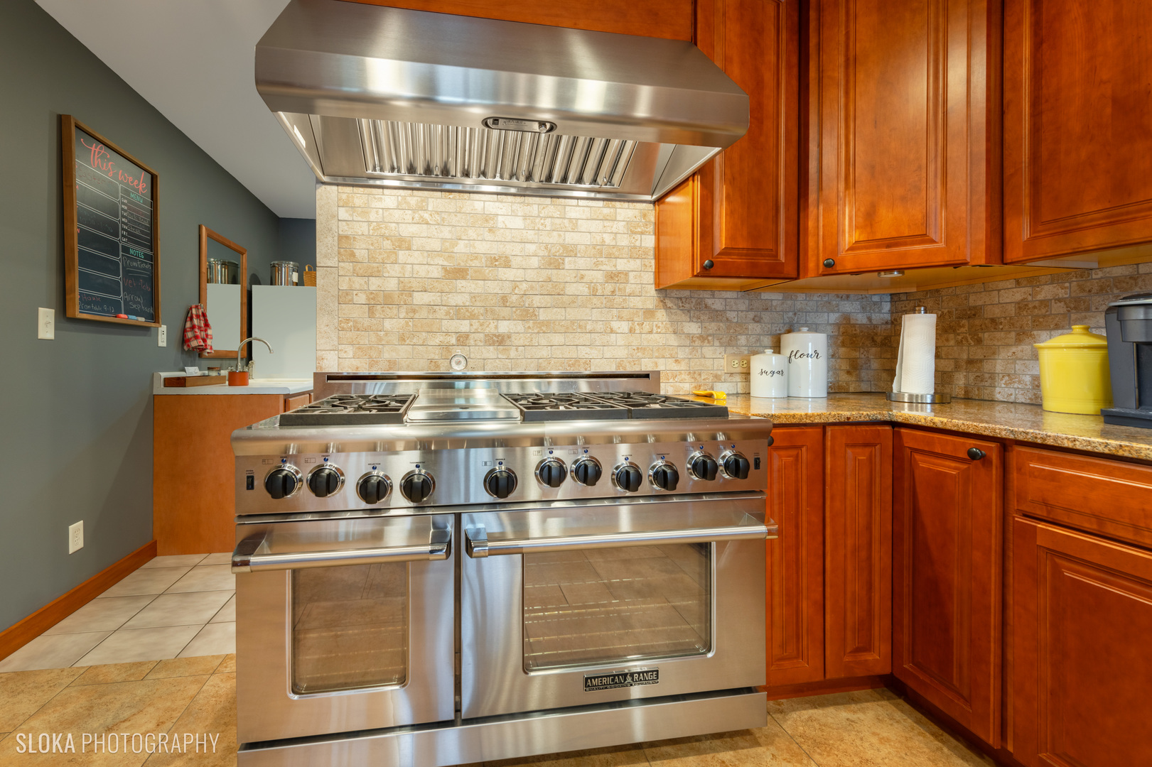 2401 West Wright Road Prairie Grove, IL 60012 - Photo 11 of 60 a kitchen with stainless steel appliances granite countertop a stove and a microwave