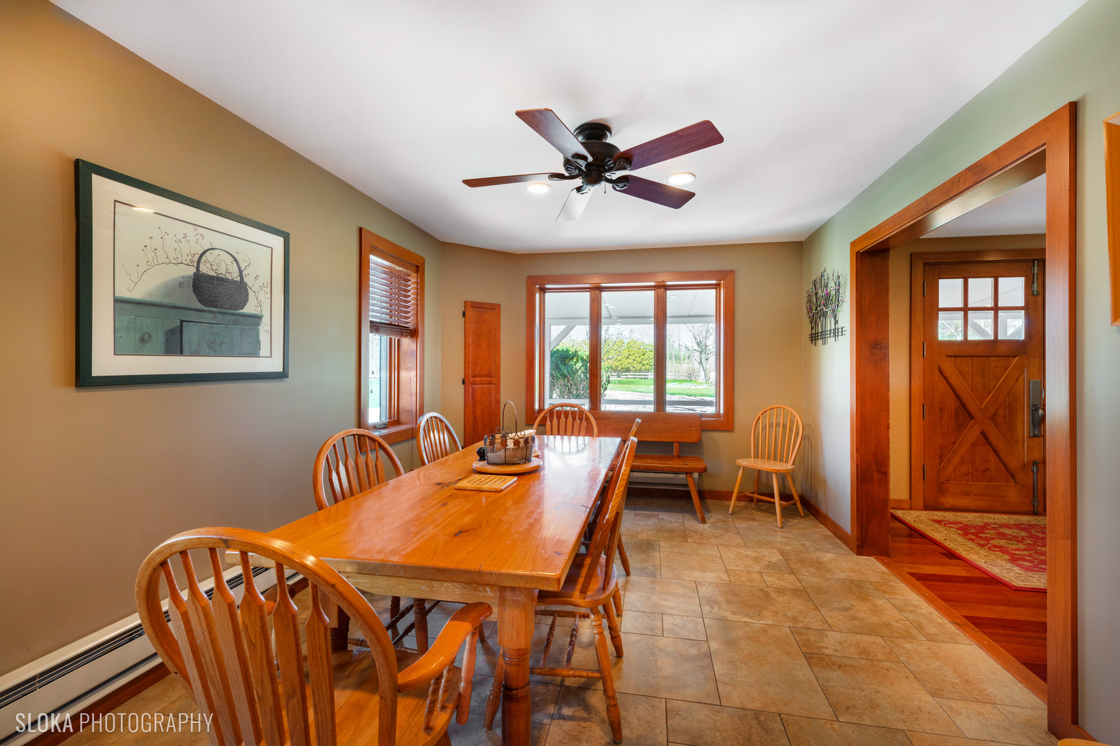 2401 West Wright Road Prairie Grove, IL 60012 - Photo 12 of 60 a dining room with furniture a flat screen tv and a large window