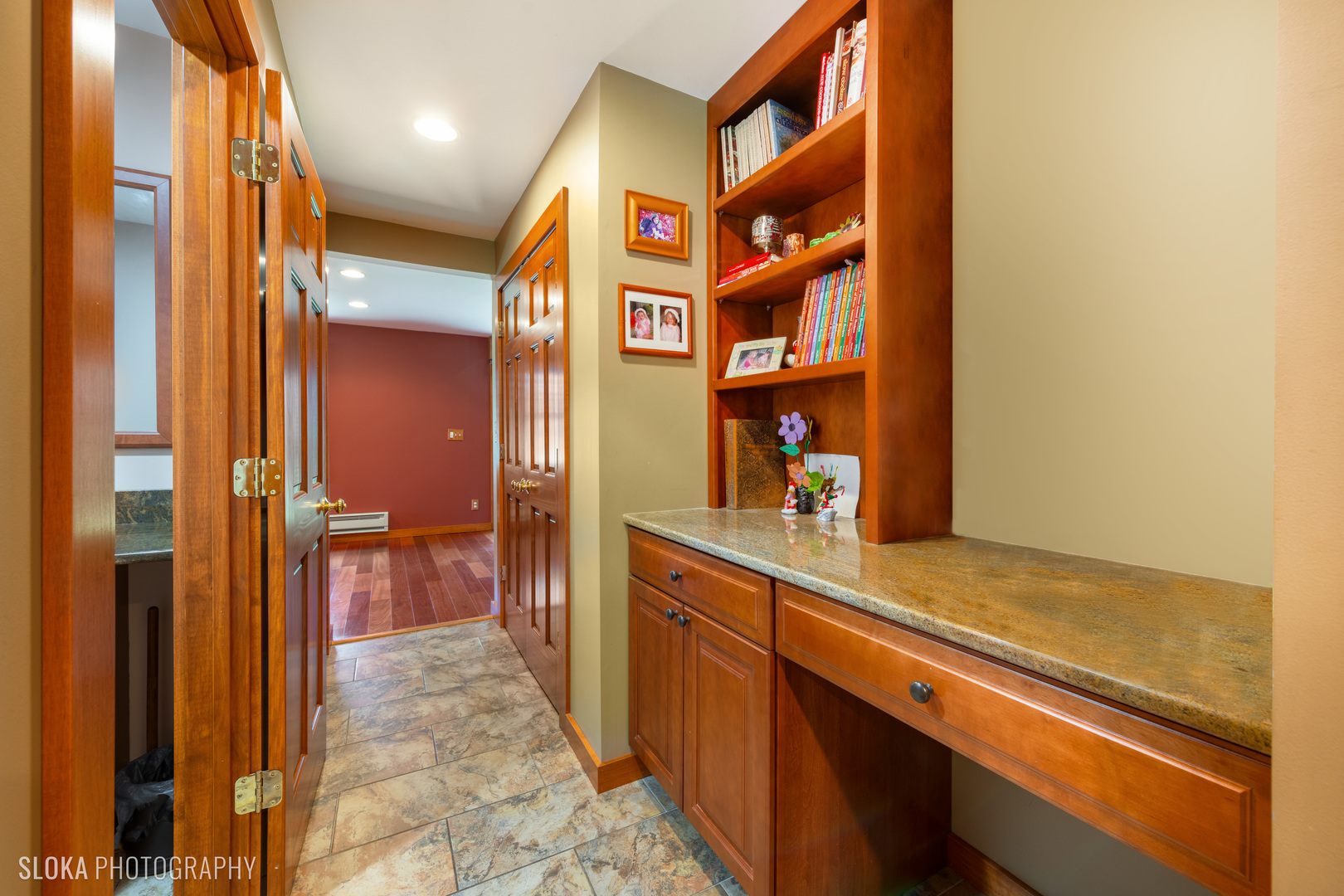 2401 West Wright Road Prairie Grove, IL 60012 - Photo 13 of 60 a hallway with a large kitchen filled with appliances and cabinets