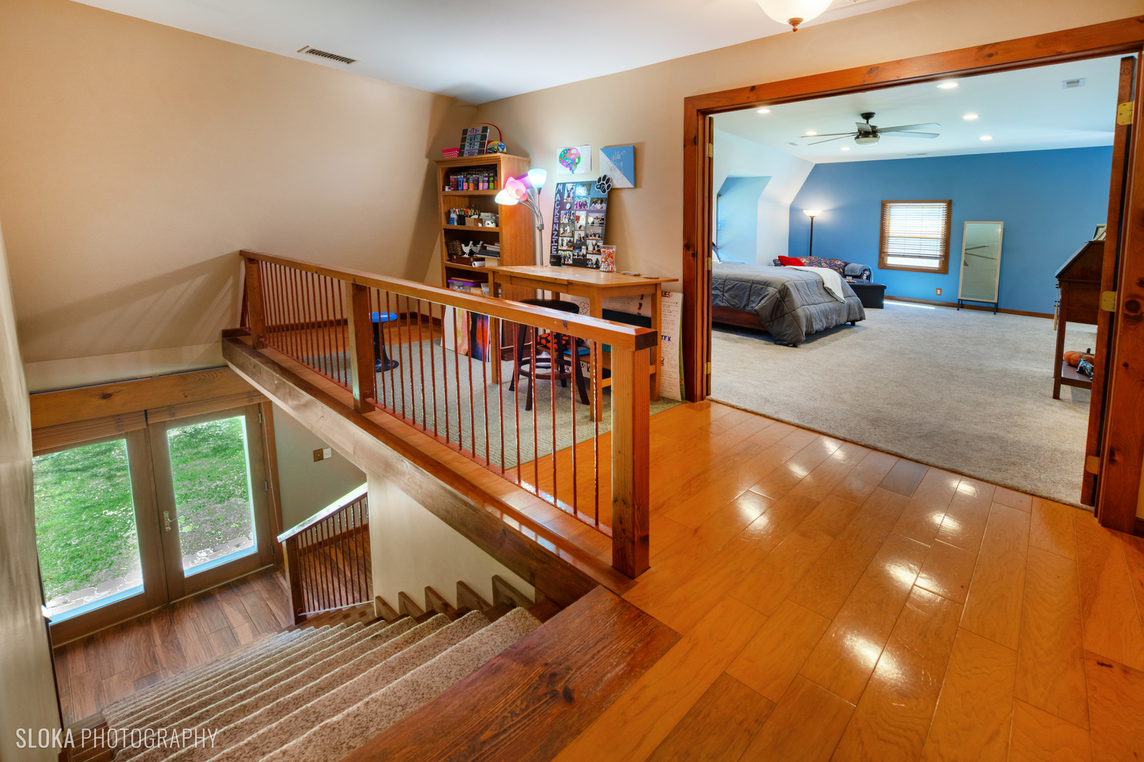 2401 West Wright Road Prairie Grove, IL 60012 - Photo 26 of 60 a view of staircase with furniture and lots of frames on wall